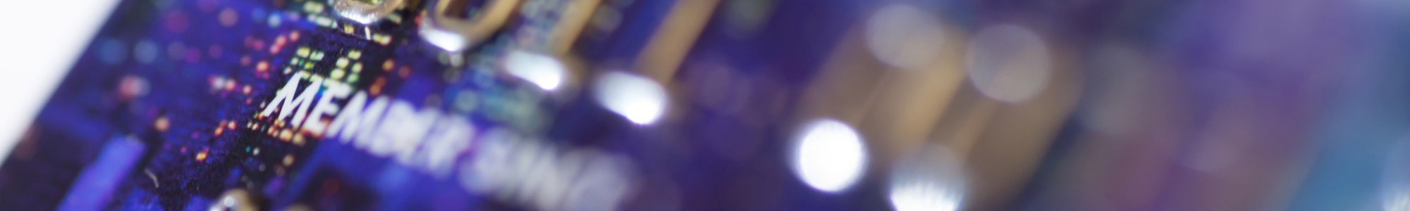 close up of a purple credit card with silver letter